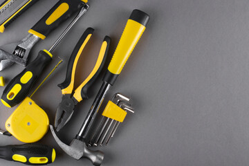 Set of hand tools on a gray background. Copy space.