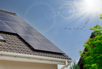 House with Solar Panels on the Roof - photovoltaic panel. 
