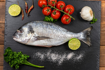 Sea bream and ingredients for cooking