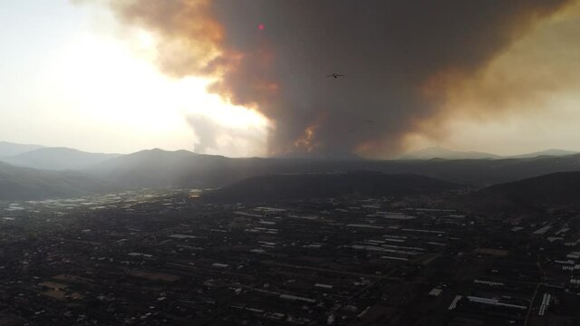 Canadair CL-415 fire fighter aircrafts flying towards forest fires near Athens Varibobi