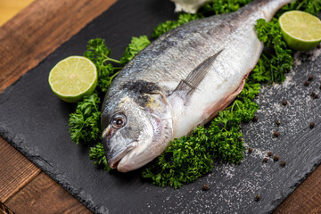 Sea bream and ingredients for cooking