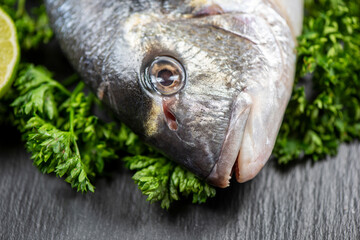 Sea bream and ingredients for cooking