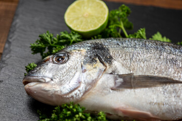 Sea bream and ingredients for cooking