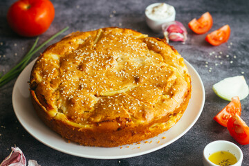 Chicken and potato pie. Tasty pie. Pie and vegetables on the table 