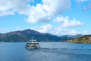 Sightseeing Cruise along the sea on beautiful view on Lake Ashi lake with mountain range background in Japan.