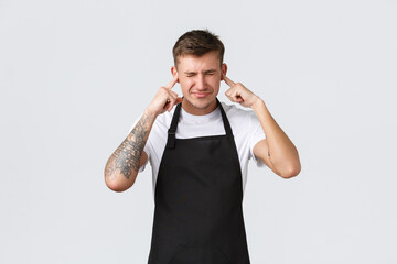 Employees, grocery stores and coffee shop concept. Bothered and annoyed barista, waiter in cafe...