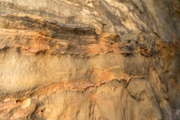 natural orange colored texture of sandstone rocks in the mountains abstract background