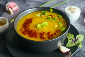 Broccoli puree soup. Delicious hot soup on a plate. Vegetarian food