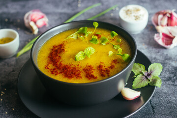 Broccoli puree soup. Delicious hot soup on a plate. Vegetarian food