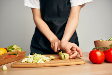 woman in apron cooking housewife in the kitchen