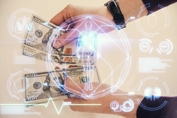 Multi exposure of education theme drawing hologram and USA dollars bills and man hands.