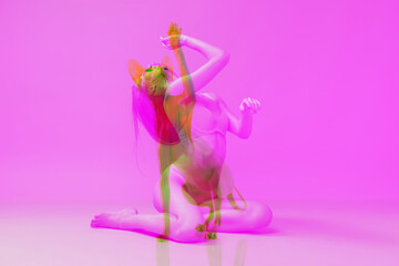 Collage with image of young adorable woman and silhouette of sphinx cat isolated over pink background with glitch effect, split personality. Art collage