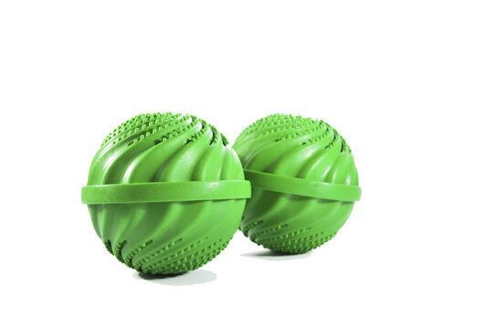 Two Green Wash Ball Of The Left Side Of A White Background