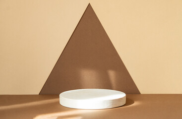 Round wooden stand for displaying goods on abstract brown-beige background. Concept of 3d podium...