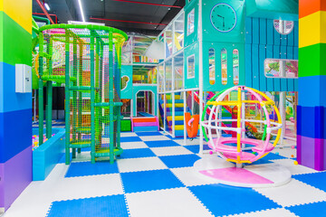 Modern children's play center, bright, colorful, children's slides, dry pool, balls, labyrinths