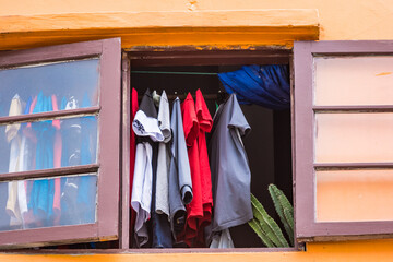 Shirt drying up inside the room.