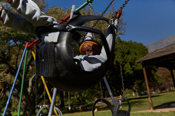 Young black girl child on a swing