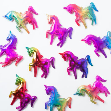 Naklejka pattern of colored unicorns isolated on white background