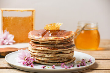 Stack Of Pancakes With Honey And Butter On Wooden Table Background. Side View.