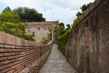 Fototapeta na wymiar Stone path in park in Girona