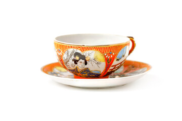 Antique Japanese Porcelain Tea Pair Cup And Saucer In The Style Of Moriage Isolated On White Background. Meiji Period.