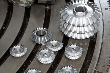 Newly manufactured gear wheels. Inside the factory. Industry background.