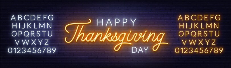 Fototapeta na wymiar Happy thanksgiving day neon sign. Greeting card on brick wall background