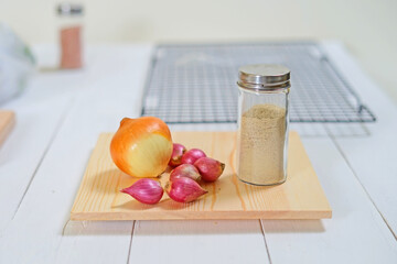 Fresh onions a common vegetable on chopping board