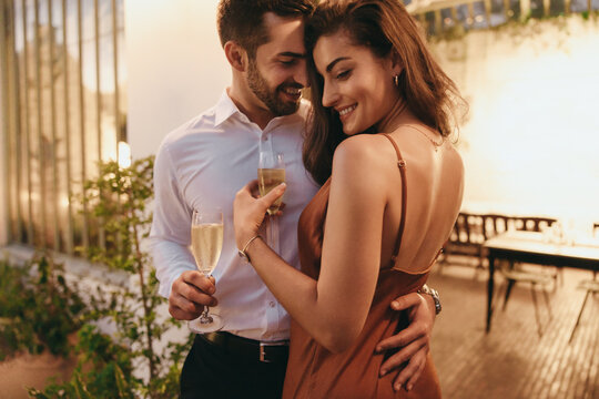 Flirty Couple Embracing Each Other In A Luxury Hotel