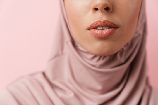 A close-up shot of the lips of a muslim woman wearing a hijab