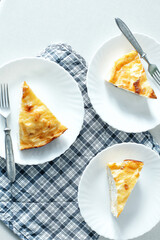 Pieces of Cheesecake on the table.top view.  Serving for breakfast. Bon Appetit. Good morning