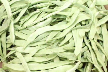 A pile of raw green bean pods