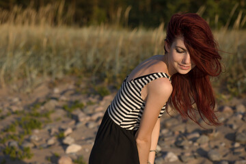 Naklejka premium Beautiful woman enjoying summer outdoors
