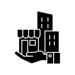 Building ownership black glyph icon. Real estate business. Private property. Company assets. Hand holds architectural structures. Silhouette symbol on white space. Vector isolated illustration