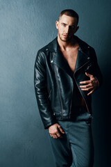 man in black leather jacket fashion modern style luxury dark background