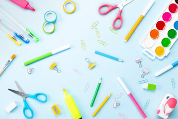 School supplies on blue background. Concept back to school