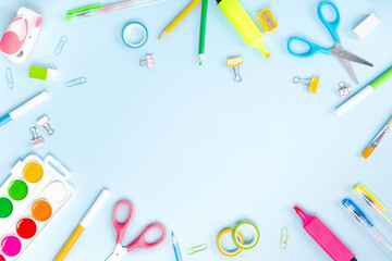 School supplies on blue background. Concept back to school