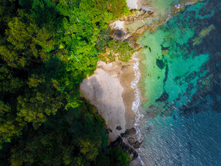 Tropical secret beach hidden in Costa Rica caribbean coast from a drone view.