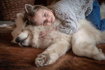  Girl and samoyed husky dog. Home