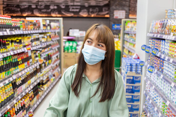 Women wear masks to shop in supermarkets, new normal lifestyles in the era of the Corona virus or Covid-19 epidemic