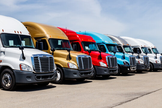 Freightliner Semi Tractor Trailer Trucks Lined up for Sale. Freightliner is owned by Daimler Trucks.