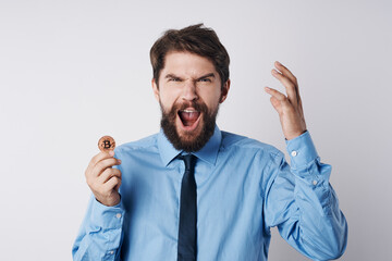 man in shirt with tie gold coin economy finance