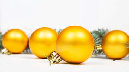 Golden Christmas balls background. Festive Christmas decoration of gold glitter. Happy new year. Banner