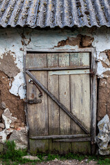 closed door leading to the old barn in the village