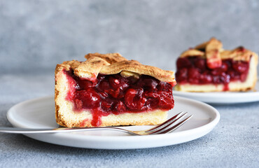 slice of cherry pie on the kitchen table. Fruit pie. Tart.