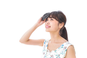 Fototapeta premium マスクを装着して指を指す若い女性