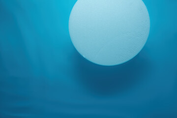 Empty white circle podium on water with waves in sunlight. layout, copyspace.Abstract background...