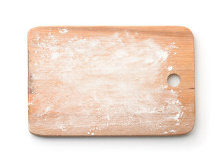 Top view of wheat flour on wooden cutting board