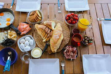 Laid table with food.breakfasts on the table top view.Large table with food top view.Table with...