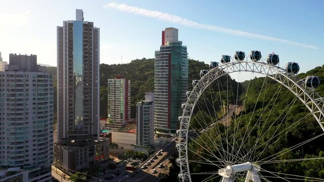 Aerial view of ferris wheel, touristic attraction at Balne&aacute;rio Cambori&uacute;, Brazil.